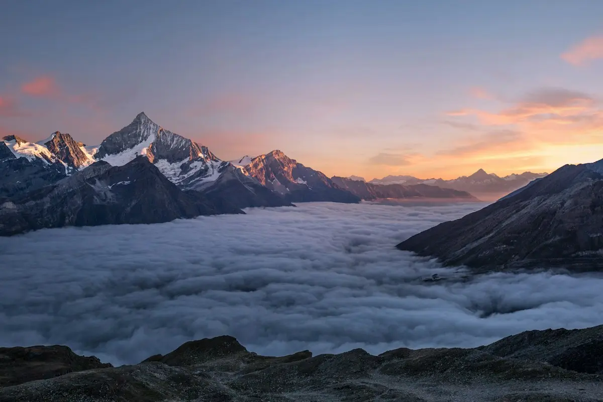 Wide mountain landscape above the clouds
